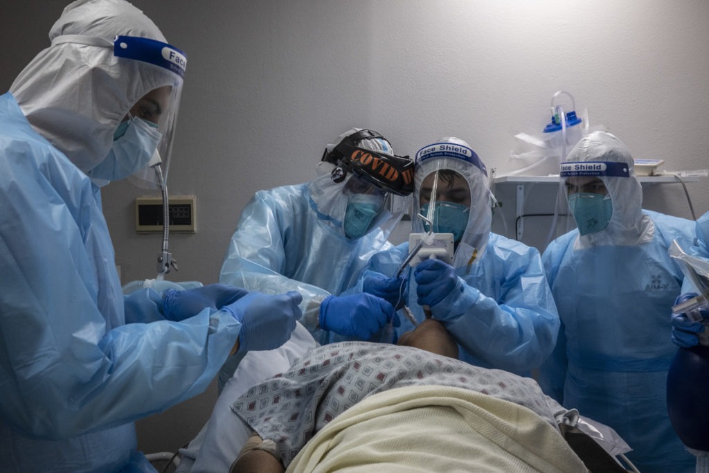 Medical staff treat a patient in the COVID-19 intensive care unit at the United Memorial Medical Center in Houston on Nov. 10. CREDIT: Go Nakamura/Getty Images