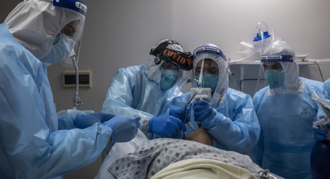 Medical staff treat a patient in the COVID-19 intensive care unit at the United Memorial Medical Center in Houston on Nov. 10. CREDIT: Go Nakamura/Getty Images