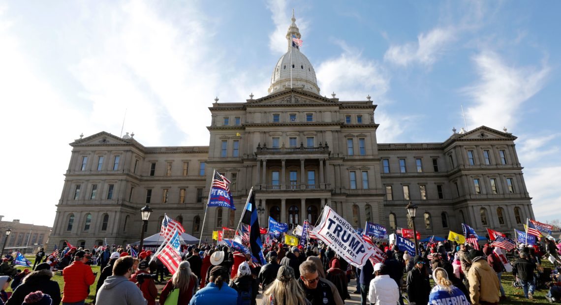 Protesters gather in support of President Trump on Nov. 14 at the Michigan Capitol in Lansing. Trump and his allies have baselessly alleged widespread voter fraud was to blame for the president's election loss. CREDIT: Jeff Kowalsky/AFP via Getty Images