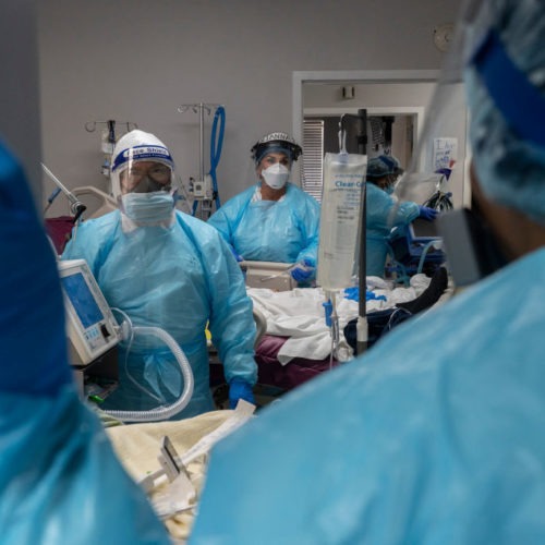 Medical staff prepare for an intubation procedure on a COVID-19 patient in a Houston intensive care unit. In some parts of the U.S., as hospitals get crowded, hospital leaders are worried they may need to implement crisis standards of care. Go Nakamura/Getty Images