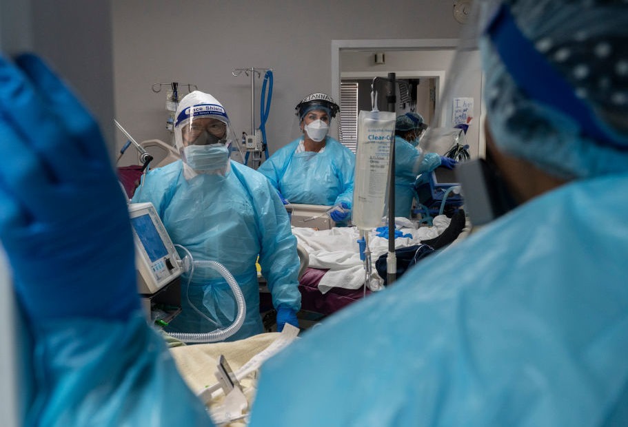 Medical staff prepare for an intubation procedure on a COVID-19 patient in a Houston intensive care unit. In some parts of the U.S., as hospitals get crowded, hospital leaders are worried they may need to implement crisis standards of care. Go Nakamura/Getty Images