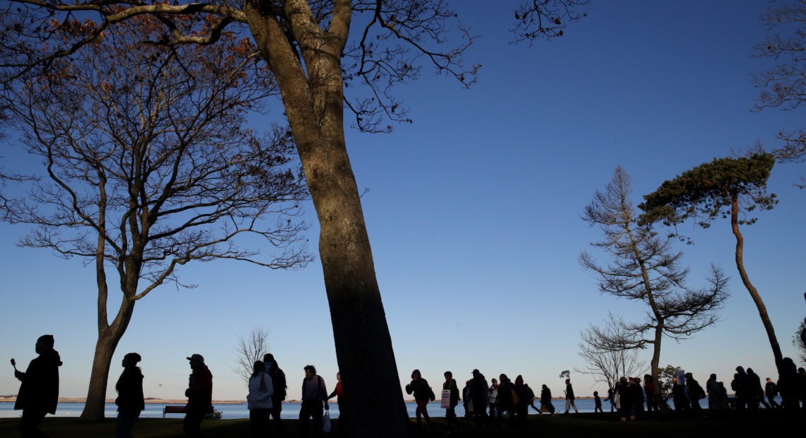 Marchers perform a Stomp Dance in Pilgrim Memorial State Park during the 48th National Day of Mourning in Plymouth, Mass., on Nov 23, 2017. Since 1970, Indigenous people have gathered at noon on Cole's Hill in Plymouth to commemorate a National Day of Mourning on Thanksgiving. Boston Globe/Boston Globe via Getty Images