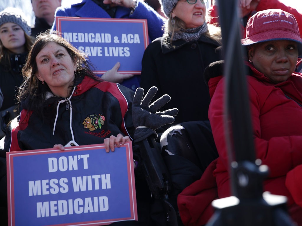 Health care activists rallied in front of the U.S. Capitol on March 22, 2017, to protest Republican efforts that would have dismantled the Affordable Care Act and capped federal payments for Medicaid patients. The Republican congressional bills, part of the party's "repeal and replace" push in 2017, were eventually defeated. CREDIT: Alex Wong/Getty Images