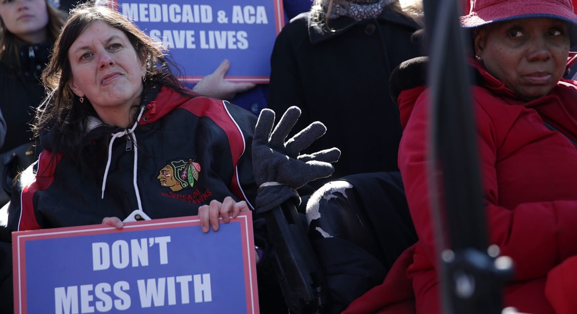 Health care activists rallied in front of the U.S. Capitol on March 22, 2017, to protest Republican efforts that would have dismantled the Affordable Care Act and capped federal payments for Medicaid patients. The Republican congressional bills, part of the party's "repeal and replace" push in 2017, were eventually defeated. CREDIT: Alex Wong/Getty Images