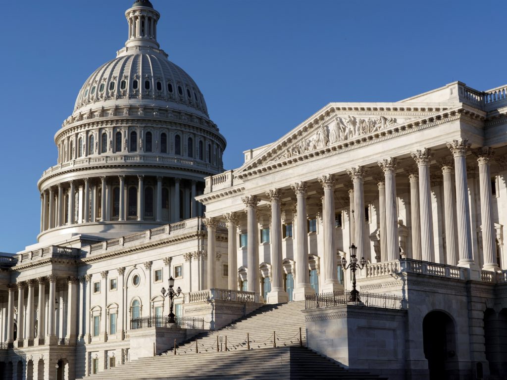 The Senate side of the Capitol is seen in Washington, D.C., early Monday. Experts say President-elect Joe Biden's ability to reshape the U.S. immigration system will be sharply limited if Republicans retain control of the Senate. CREDIT: J. Scott Applewhite/AP