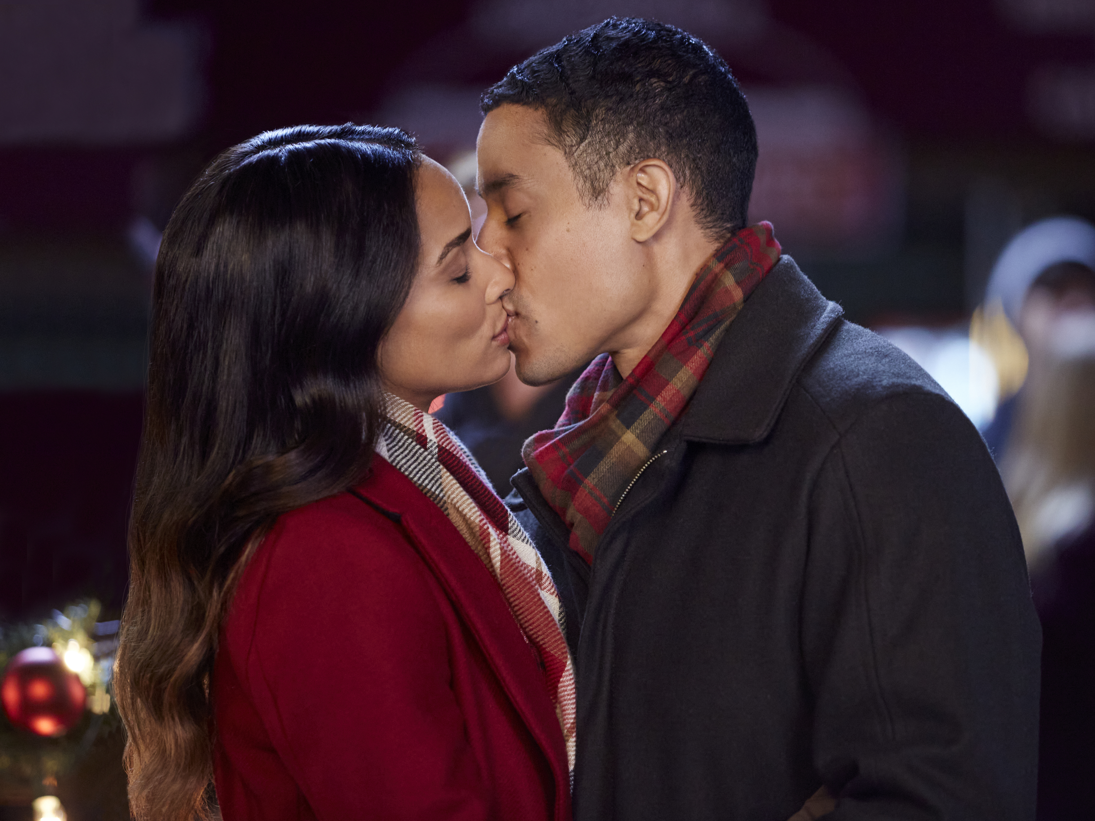 Rochelle Aytes and Mark Taylor star in one of the Hallmark Channel's many new holiday rom-coms, A Christmas Tree Grows in Colorado. Ryan Plummer/2020 Crown Media