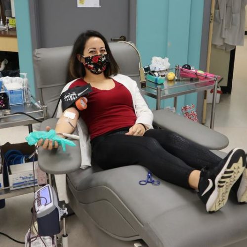 Donor Kaitlan Vasquez giving blood in Olympia on the third anniversary of the Amtrak 501 train wreck in December 2017. CREDIT: Tom Banse/N3