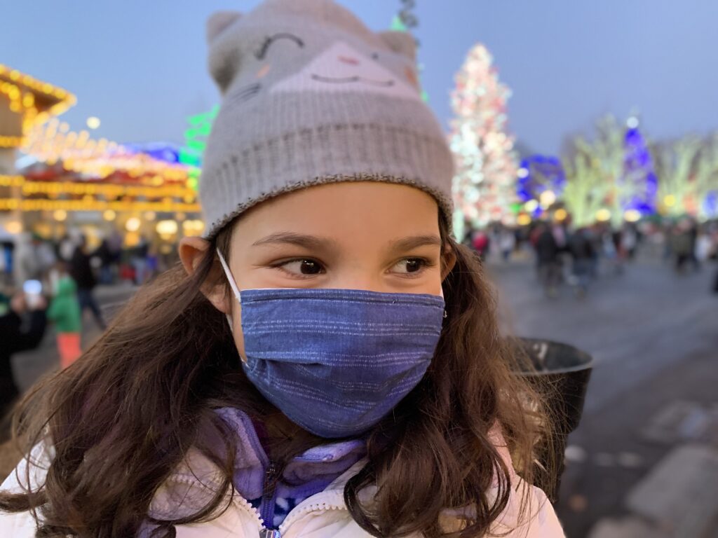 Marisol Garcia, 8, says she especially loves the pink, purple and blue lights in Leavenworth, Wash. Her family came to see the lights, but say they were reluctant of the crowds.