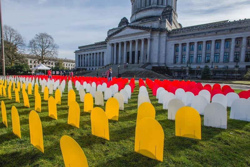 Mock headstones outside the State Capitol mark the number of people who died by suicide in Washington in one year as part of an education event during the 2017 legislative session. Courtesy of Jo Arlow