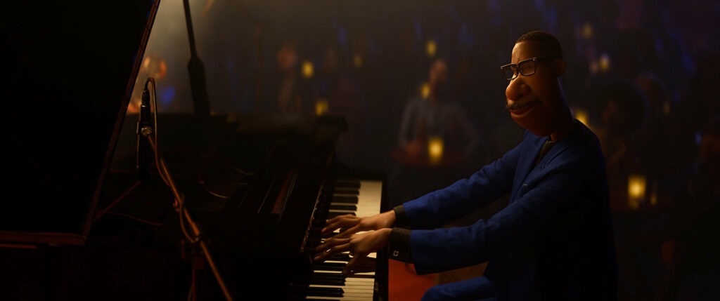 In Soul, Joe Gardner is a middle-school band teacher whose true passion is playing jazz. Musician Jon Batiste wrote original music and performed it for the Pixar film, which animated his fingers playing the piano. Disney/Pixar