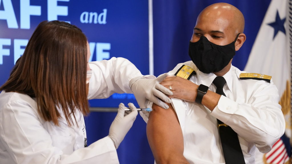 U.S. Surgeon General Jerome Adams said the symbolic significance of his vaccination was important in sending a message to Black Americans that it is safe. CREDIT: Andrew Harnik/AP