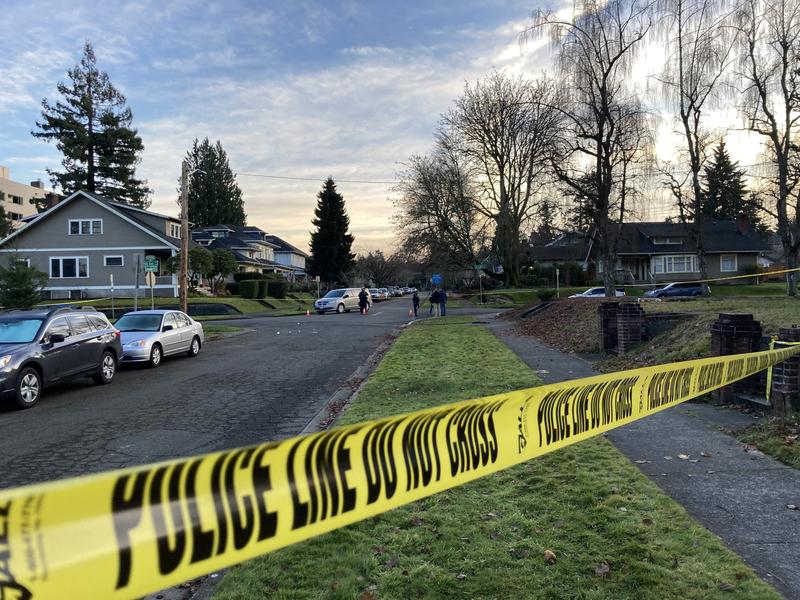 Police tape blocks a street near Washington's Capitol Campus where a person was shot Saturday, Dec. 12, 2020, as far right and far left protesters clashed.