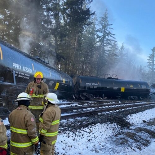 Fire crews respond to the scene of a derailed train in the city of Custer, Washington, in Whatcom County on Tuesday, December 22, 2020. A BNSF spokesperson said seven train cars derailed and two caught fire. CREDIT: Washington Dept. of Ecology