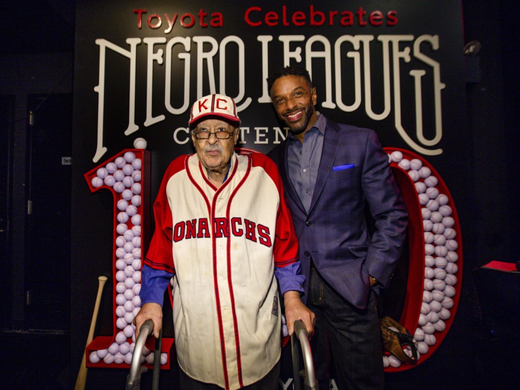 Negro Leagues baseball veteran Jim Robinson, left, and ESPN/ABC correspondent Ryan Smith, seen in New York in February. CREDIT: Donald Traill/AP