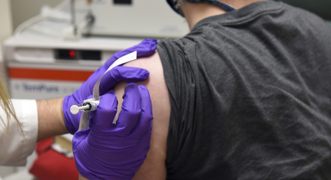 Administering COVID-19 vaccine during trial of the Pfizer covid trial.