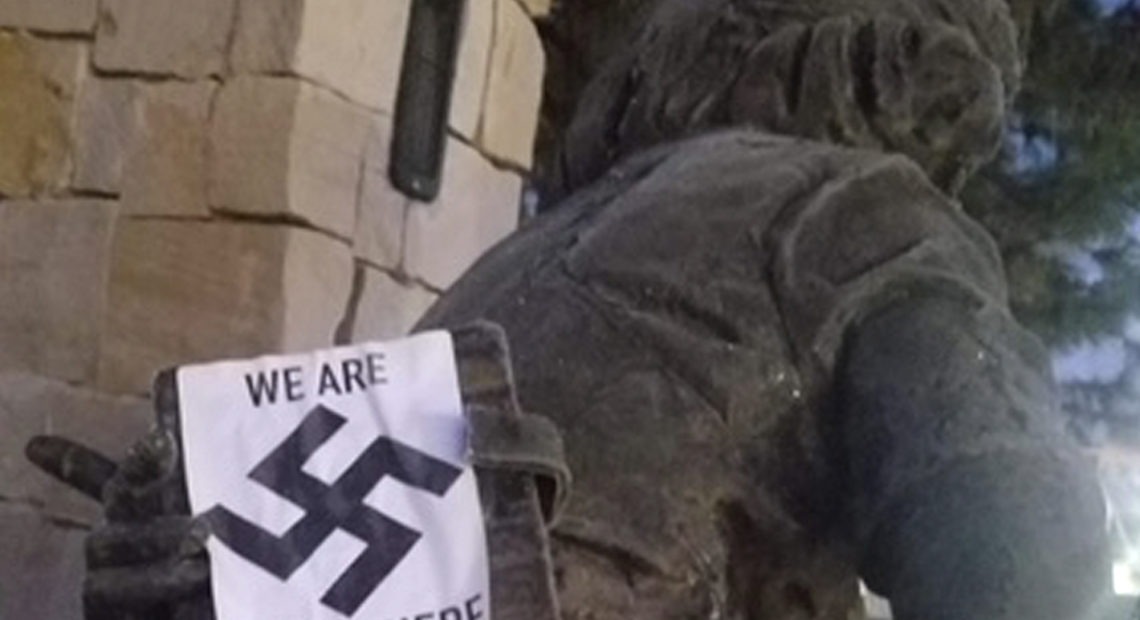 A swastika sticker on a statue at the Idaho Anne Frank Human Rights Memorial in Boise. The vandalism took place sometime between Monday evening and Tuesday morning, Boise police said. Wassmuth Center for Human Rights via AP