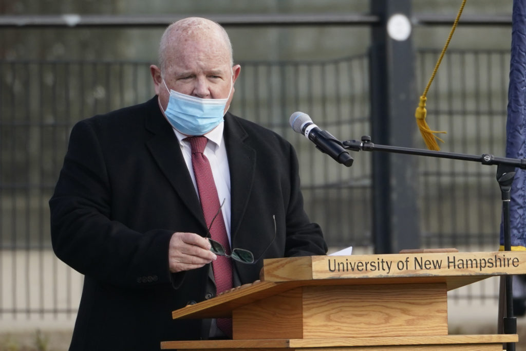 New Hampshire House Speaker Dick Hinch speaks on Dec. 2 during an outdoor legislative session at the University of New Hampshire in Durham, N.H. Hinch died of COVID-19 on Dec. 9, just a week after he was sworn in as leader of the state's newly Republican-led House. He was 71. CREDIT: Elise Amendola/AP