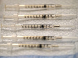 Prepared COVID-19 Pfizer-BioNTech vaccine syringes are seen at Edward Hospital in Naperville, Ill., Thursday, Dec. 17, 2020. Illinois received about 43,000 doses in its first shipment of a COVID-19 vaccine Monday as health officials reported another 103 coronavirus deaths statewide. Most of the shots will be distributed to local health care centers for health care workers, according to Illinois Gov. J.B. Pritzker's office. CREDIT: Nam Y. Huh/AP
