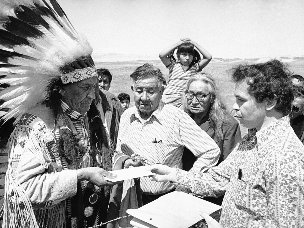 Hank Adams, right, died Dec. 21 at the age of 77. Adams fought for Native American treaty rights throughout his life. CREDIT: Anonymous/AP