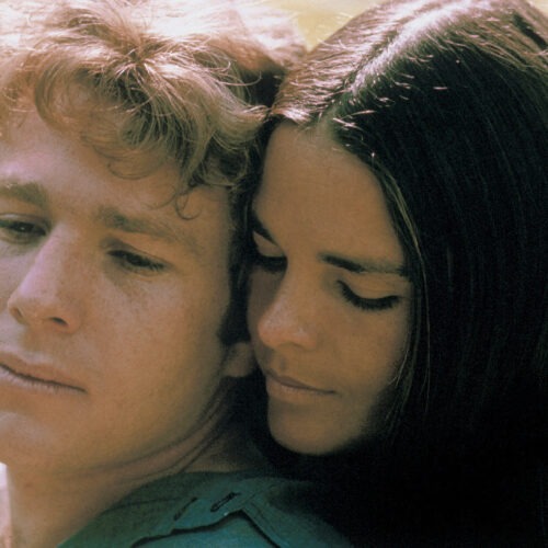 Ryan O'Neal and Ali MacGraw starred in Love Story — a romantic tearjerker that became the highest grossing movie of 1970. Since then, it has inspired countless ugly cries — and plenty of parodies, too. Paramount Pictures