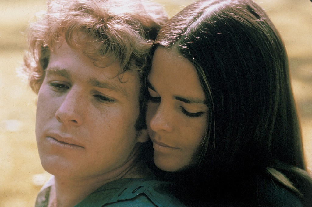Ryan O'Neal and Ali MacGraw starred in Love Story — a romantic tearjerker that became the highest grossing movie of 1970. Since then, it has inspired countless ugly cries — and plenty of parodies, too. Paramount Pictures