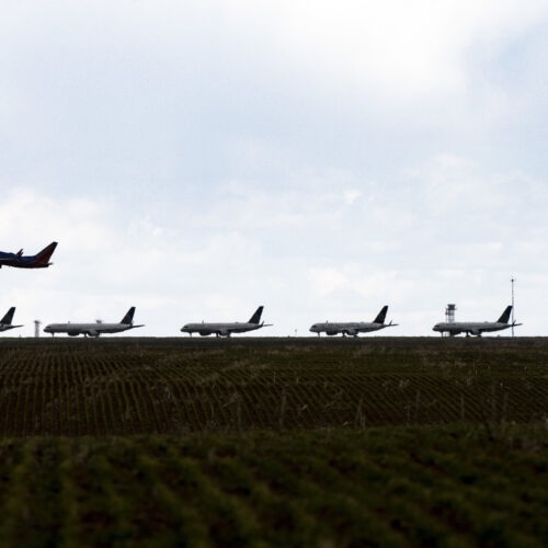 A Southwest Airlines flight takes off as United Airlines planes sit parked on a runway at Denver International Airport in April. CREDIT: Michael Ciaglo/Getty Images