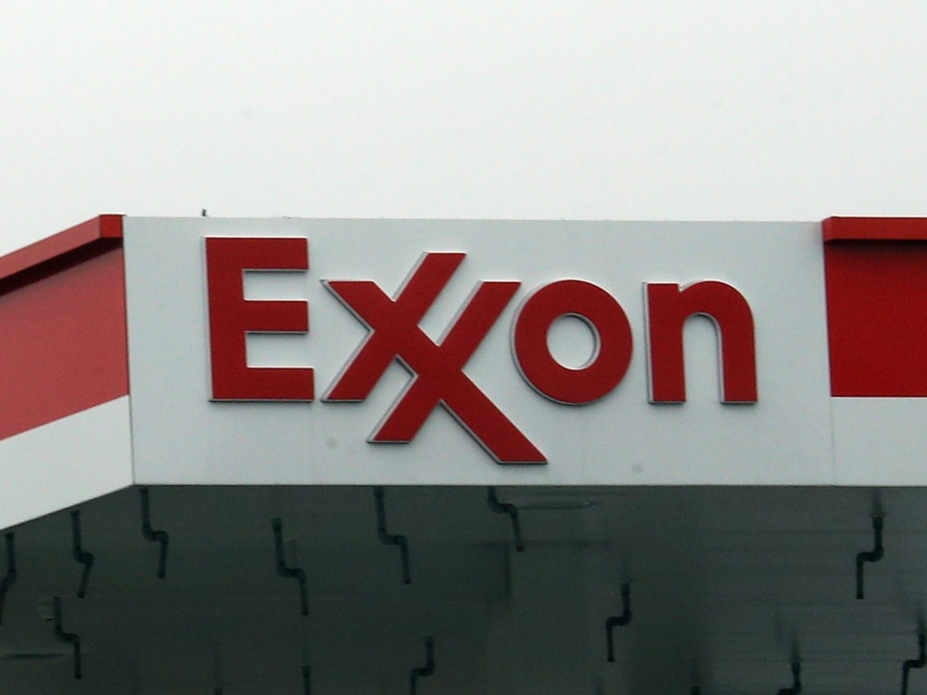 An Exxon station in Hicksville, N.Y., in March. Exxon Mobil Corp. announced up to $20 billion in write-downs of natural gas assets, the biggest such action ever by the company. Bruce Bennett/Getty Images