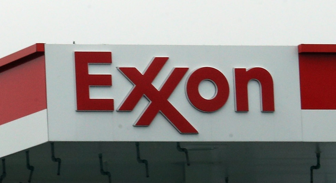 An Exxon station in Hicksville, N.Y., in March. Exxon Mobil Corp. announced up to $20 billion in write-downs of natural gas assets, the biggest such action ever by the company. Bruce Bennett/Getty Images