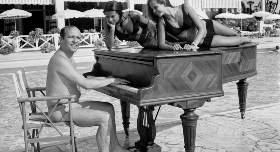 A shot of jazz pianist Claude Bolling and friends, taken on a beach in Cannes, France in 1969. CREDIT: AFP via Getty Images
