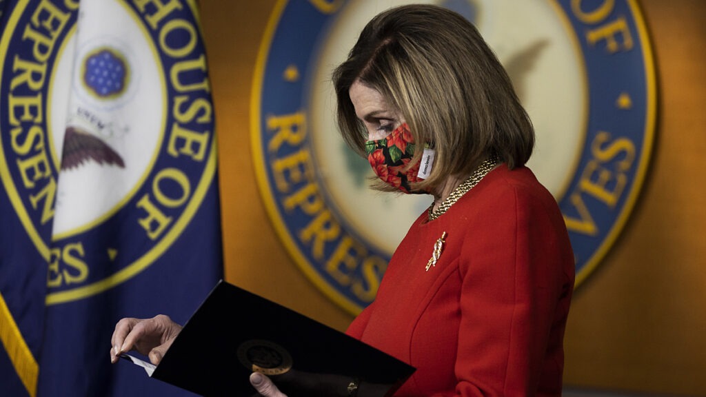 House Speaker Nancy Pelosi, D-Calif., holds a press conference Sunday. Congress is scrambling after President Trump blasted a major aid and spending package that lawmakers passed Monday. CREDIT: Tasos Katopodis/Getty Images