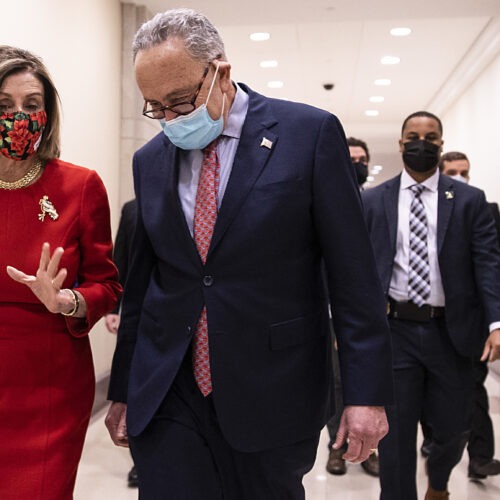 House Speaker Nancy Pelosi, D-Calif., and Senate Minority Leader Chuck Schumer, D-N.Y., speak Sunday following a press conference on Capitol Hill after Republicans and Democrats finally came to an agreement on the coronavirus relief bill. CREDIT: Tasos Katopodis/Getty Images