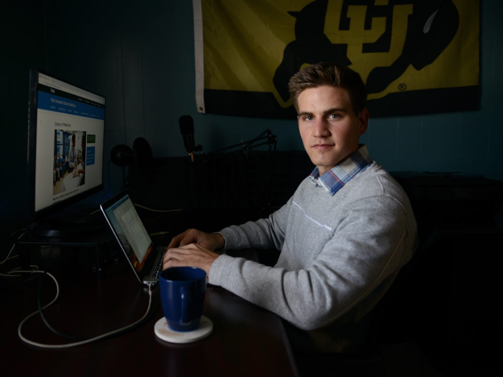 Sam Smith, a University of Colorado Boulder grad who is applying to medical schools, says he has been inspired by the example of health care workers during the pandemic. He plans to specialize in infectious diseases. "I want to be on the front lines of the next one," he says. CREDIT: Meredith Nierman