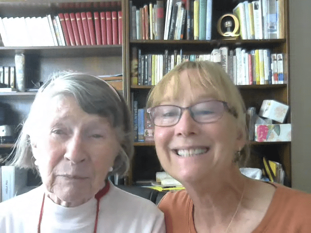 Mother and daughter pose after sharing stories about the 1918 pandemic and Covid-19 pandemic.