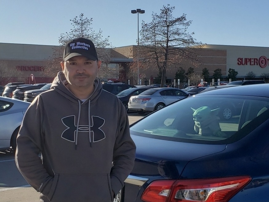 Willy Solis outside his workplace in a parking lot