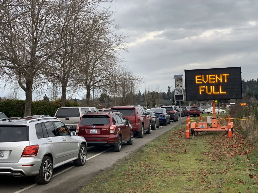 Eager seniors filled up all of the first come, first serve slots at a drive-thru COVID vaccination clinic before the first shots were even given on Thursday in Sequim, Washington. CREDIT: Tom Banse/N3