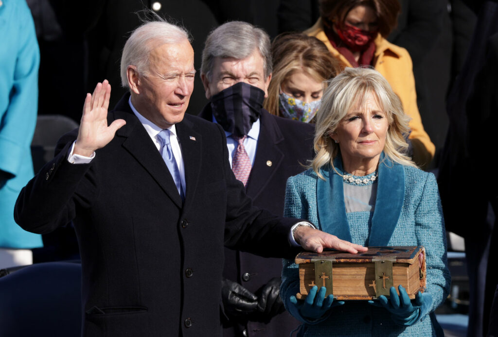 Joe Biden is sworn in as president as his wife, Jill, looks on during his inauguration on the West Front of the U.S. Capitol on Wednesday. CREDIT: Alex Wong/Getty Images