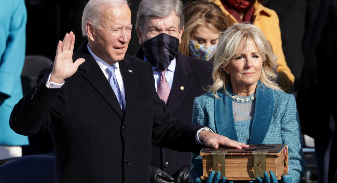 Joe Biden is sworn in as president as his wife, Jill, looks on during his inauguration on the West Front of the U.S. Capitol on Wednesday. CREDIT: Alex Wong/Getty Images