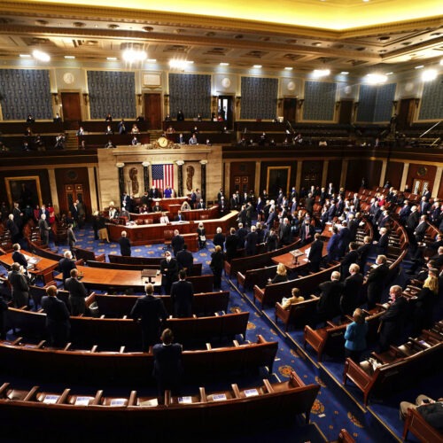 Speaker of the House Nancy Pelosi, D-Calif., and Vice President Mike Pence officiated as a joint session of the House and Senate worked to confirm the Electoral College votes cast in November's election. Jim Lo Scalzo/AP