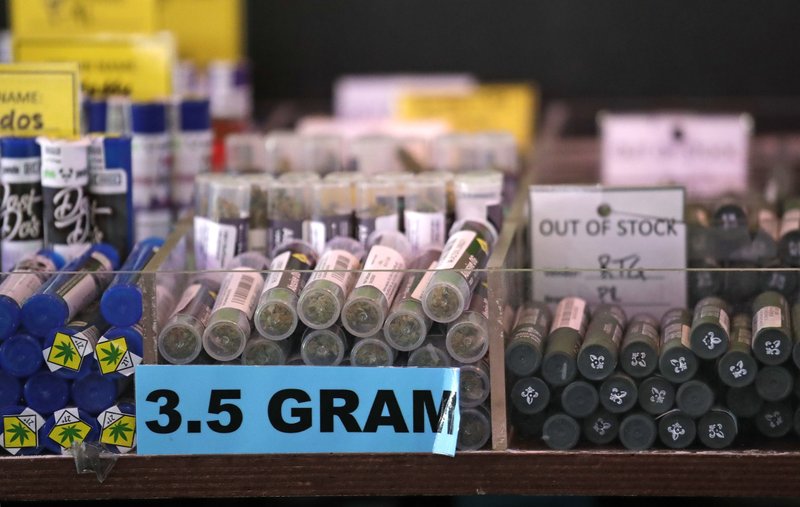 In this March 28, 2019 photo pot products line a display case at a marijuana shop in Seattle. A proposed constitutional amendment that would prevent the legalization of marijuana in Idaho has moved forward as lawmakers in the state try to halt the increasing acceptance of the drug nationwide. CREDIT: Elaine Thompson/AP
