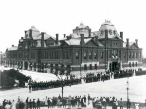 View of National Guard lined up in street with striking workers across on the block during the Pullman Railcar Worker's strike. 