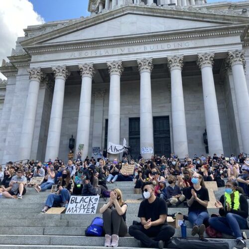 Advocates for police accountability and racial justice rallied on the steps of the Washington Capitol in June 2020. Now the Washington Legislature is taking up those issues as it welcomes a record number of lawmakers of color. CREDIT: Austin Jenkins/N3