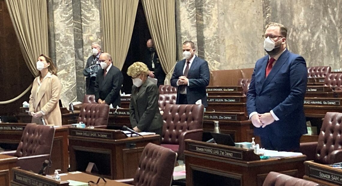 The Washington State Senate convened Monday, Jan. 11 to approve the rule that will allow them to meet mostly remotely during the session. In person, only eight people are allowed on the Senate floor, and all must wear facial coverings. CREDIT: Austin Jenkins/N3