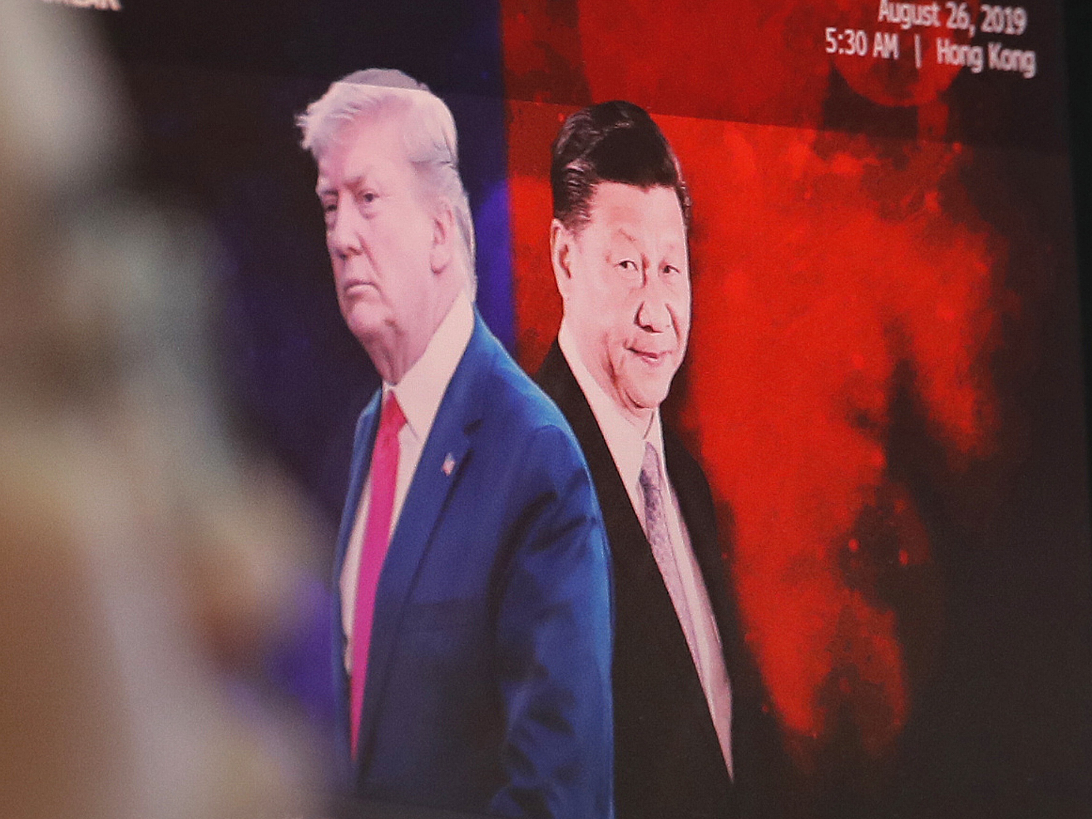 A computer screen in Seoul shows images of Chinese President Xi Jinping and President Donald Trump in 2019. Ahn Young-joon/AP