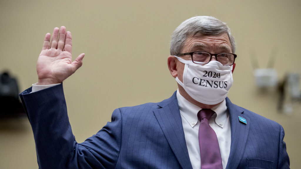 Census Bureau Director Steven Dillingham, a Trump appointee who wore a "2020 Census" mask while swearing in to testify before a congressional hearing last year, is set to leave on Jan. 20, months before his term ends on Dec. 31. Andrew Harnik/AP