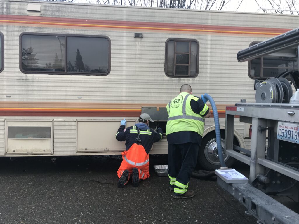 With the help of a contractor, Chris Wilkerson makes monthly visits to RVs and motor homes around the city that don't have access to dumping stations.