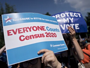 A demonstrator holds a sign about the U.S. census outside the Supreme Court in Washington, D.C., in 2019. The Census Bureau has stopped all work on President Trump's directive to produce a count of unauthorized immigrants that could be subtracted from a key set of census numbers, NPR has learned. Andrew Harrer/Bloomberg via Getty Images