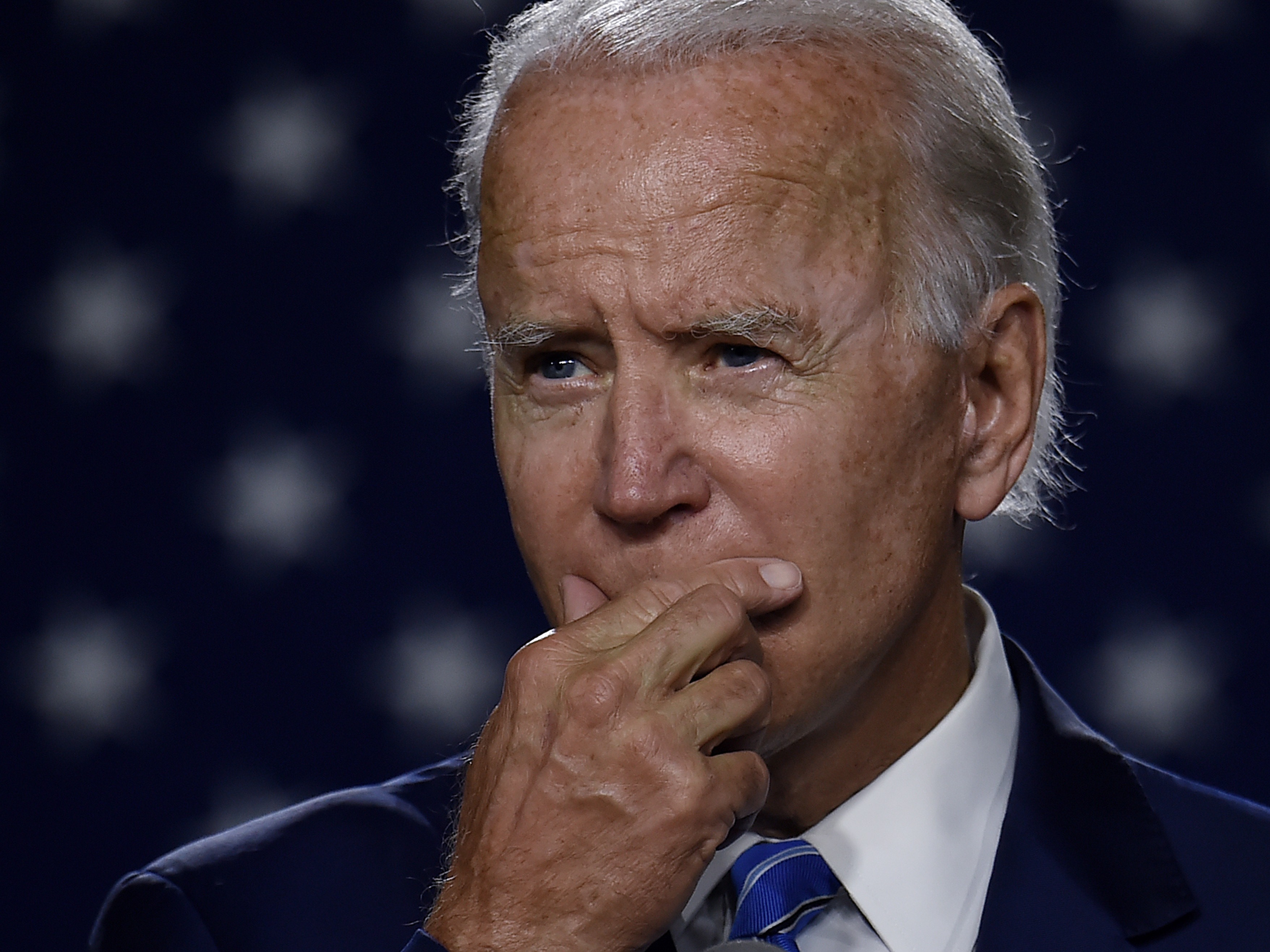 Then presidential candidate Joe Biden speaks at a "Build Back Better" Clean Energy event on July 14, 2020. On Thursday, Biden unveiled an ambitious economic plan just days before he's set to be inaugurated as president. CREDIT: Olivier Douliery/AFP via Getty Images