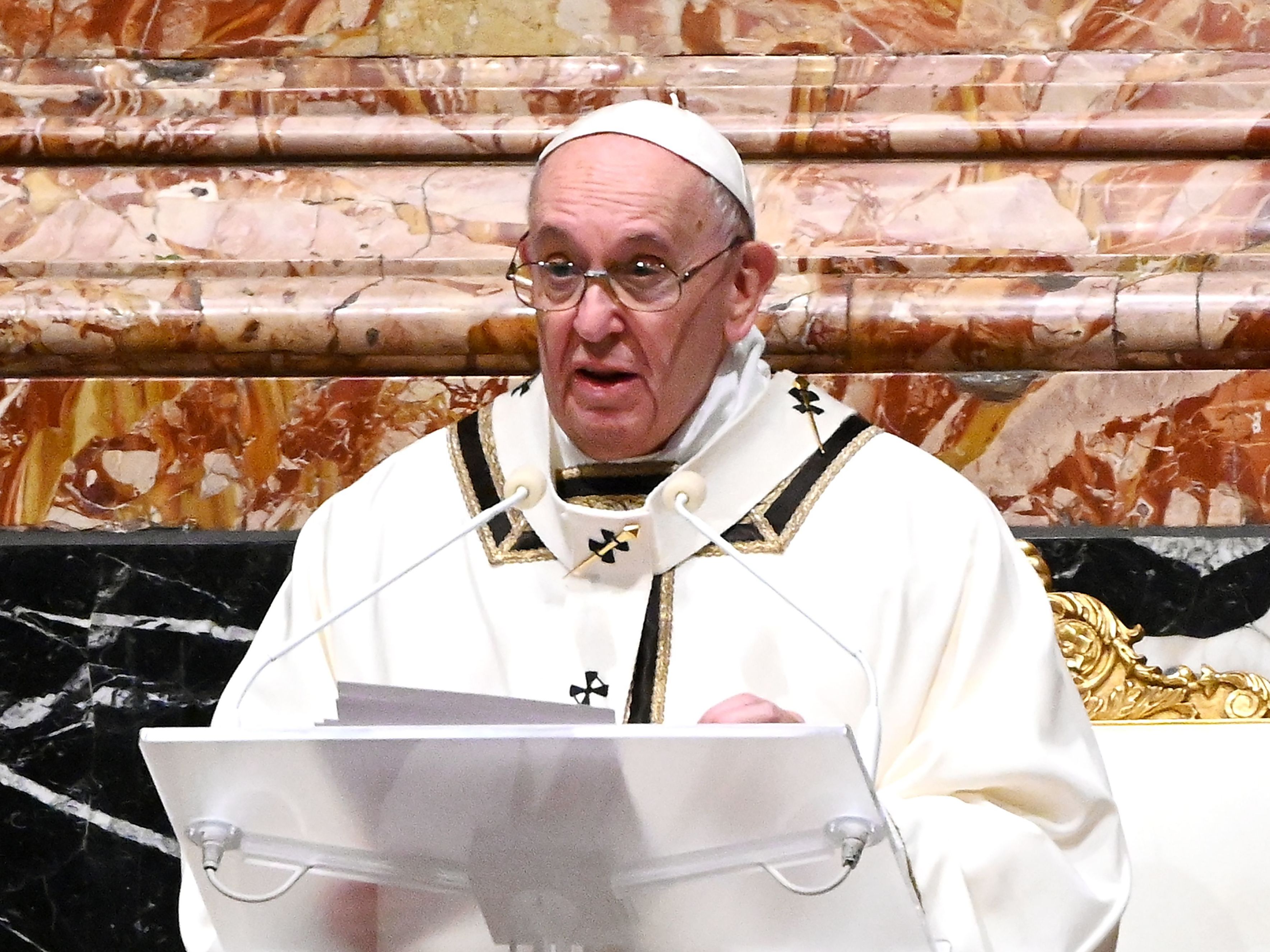 Pope Francis is seen giving a homily on Christmas Eve. Francis on Sunday condemned the violence at the U.S. Capitol and prayed for reconciliation. Vincenzo Pinto/Pool/AFP via Getty Images