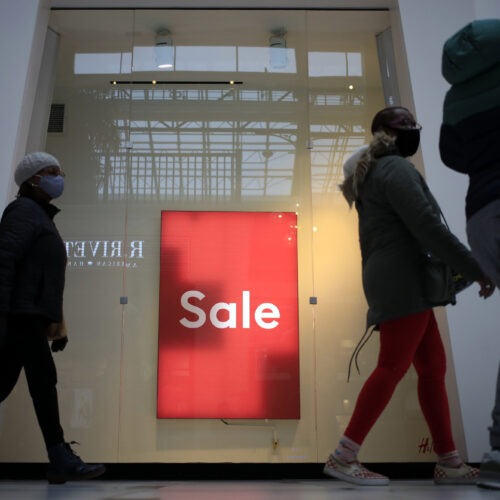 Shoppers walk past a "Sale" sign outside a store at the Easton Town Center Mall in Columbus, Ohio, on Jan. 7. CREDIT: Luke Sharrett/Bloomberg via Getty Images