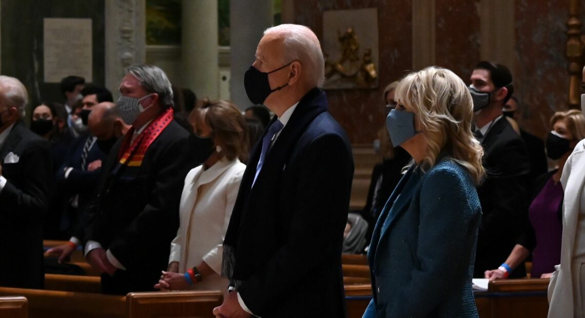 Joe and Jill Biden attend Mass at the Cathedral of St. Matthew the Apostle in Washington, D.C., on Wednesday morning before his inauguration. Jim Watson/AFP via Getty Images